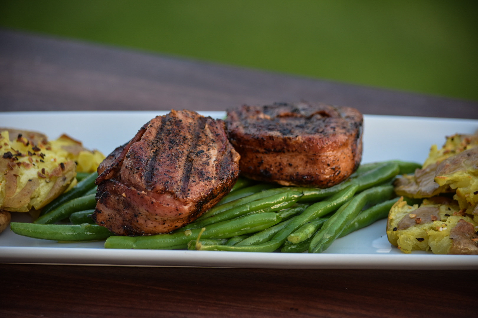 Josh’s Reverse Seared Bacon Wrapped Pork Filets with Crispy Smashed Potatoes & Garlic Green Beans